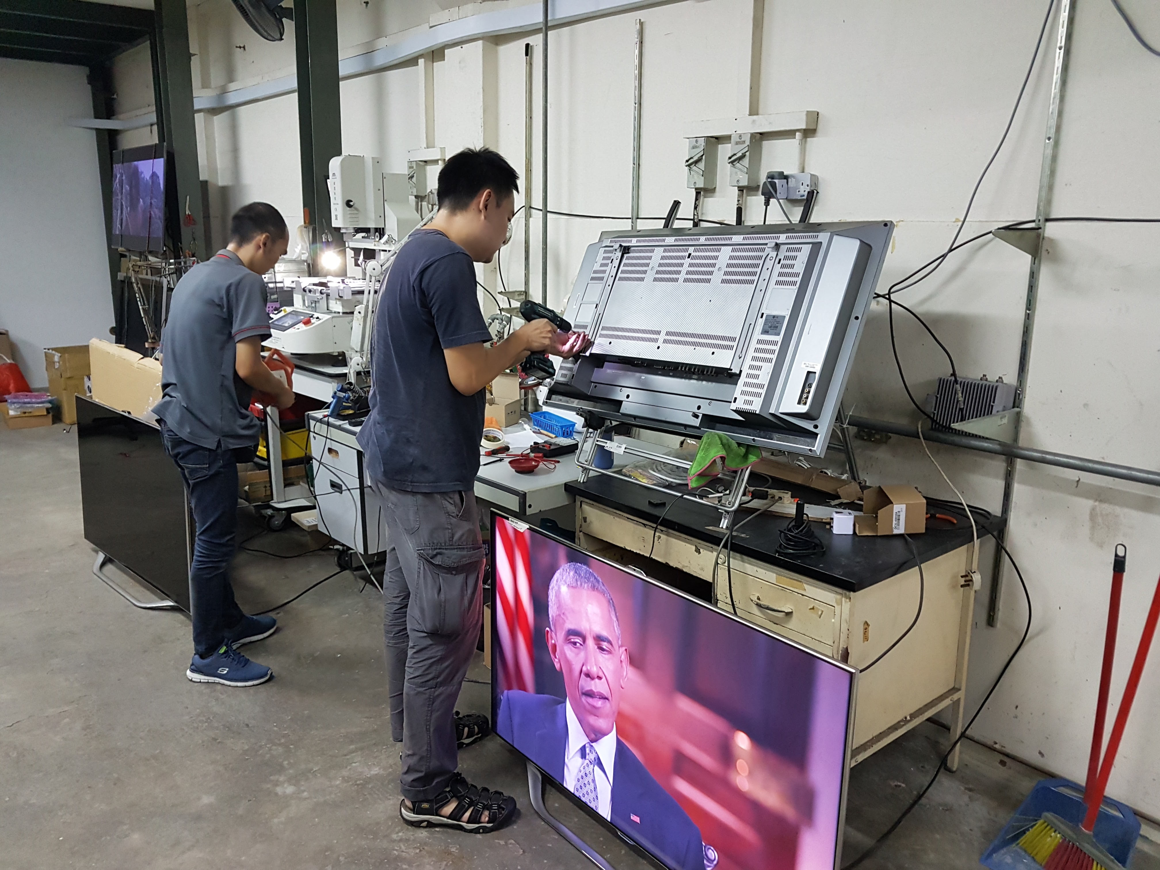 Man repairing TV